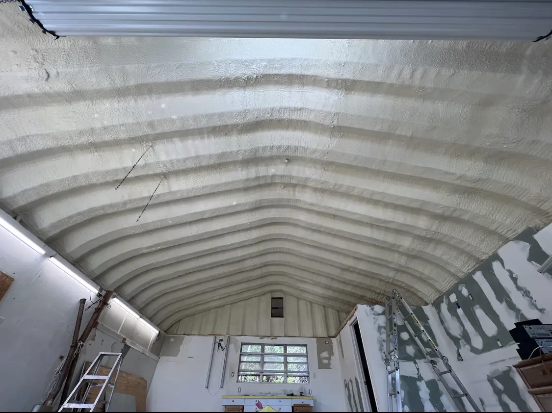 Spray polyurethane foam applied to the underside of a metal roof deck in Odenton